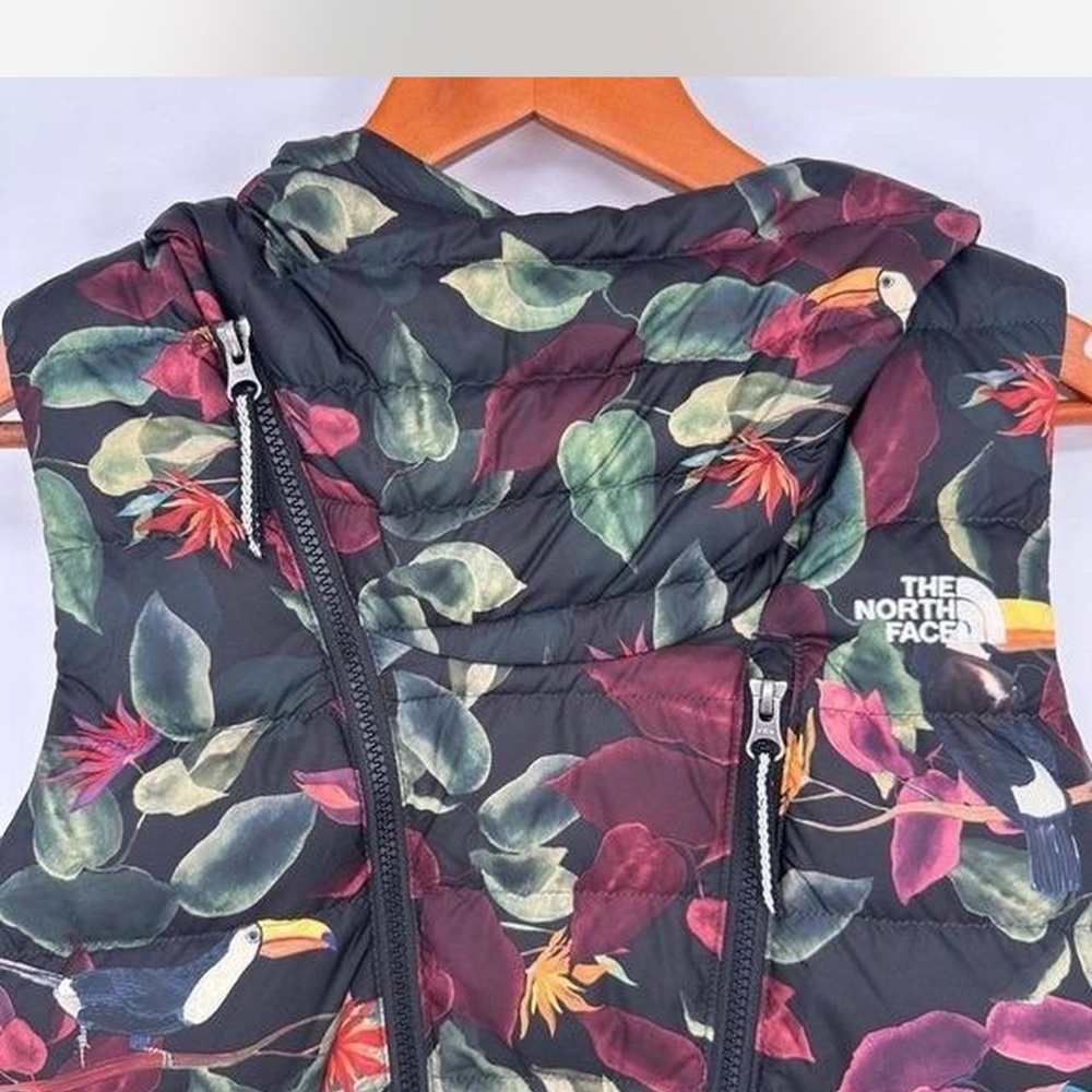 The North Face Black Vest with floral toucan design. Hooded. Down filled. Rare